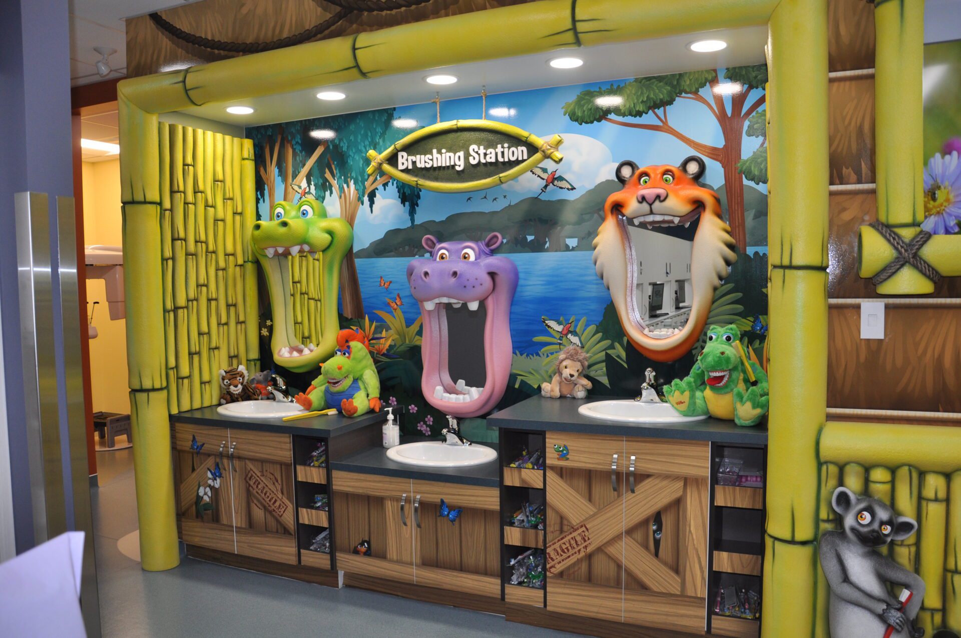 Cool Smiles Brushing Station featuring mirrors with cartoon styled animal shapes<br />
